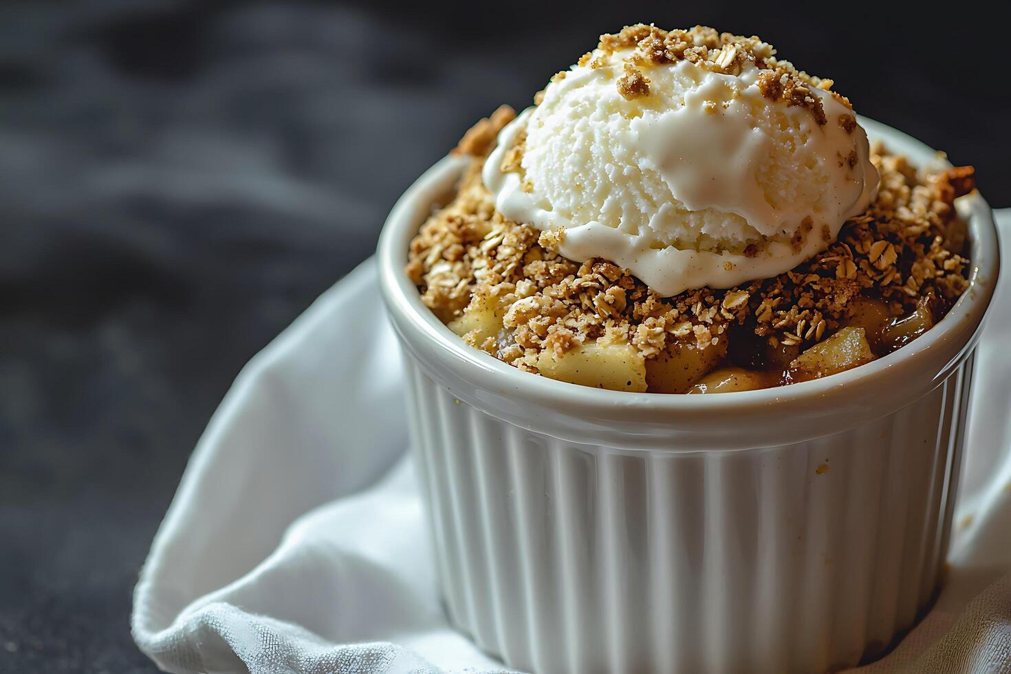 Delicious Apple Crumble with a Scoop of Vanilla Ice Cream. A close-up shot of a warm, comforting dessert. photo