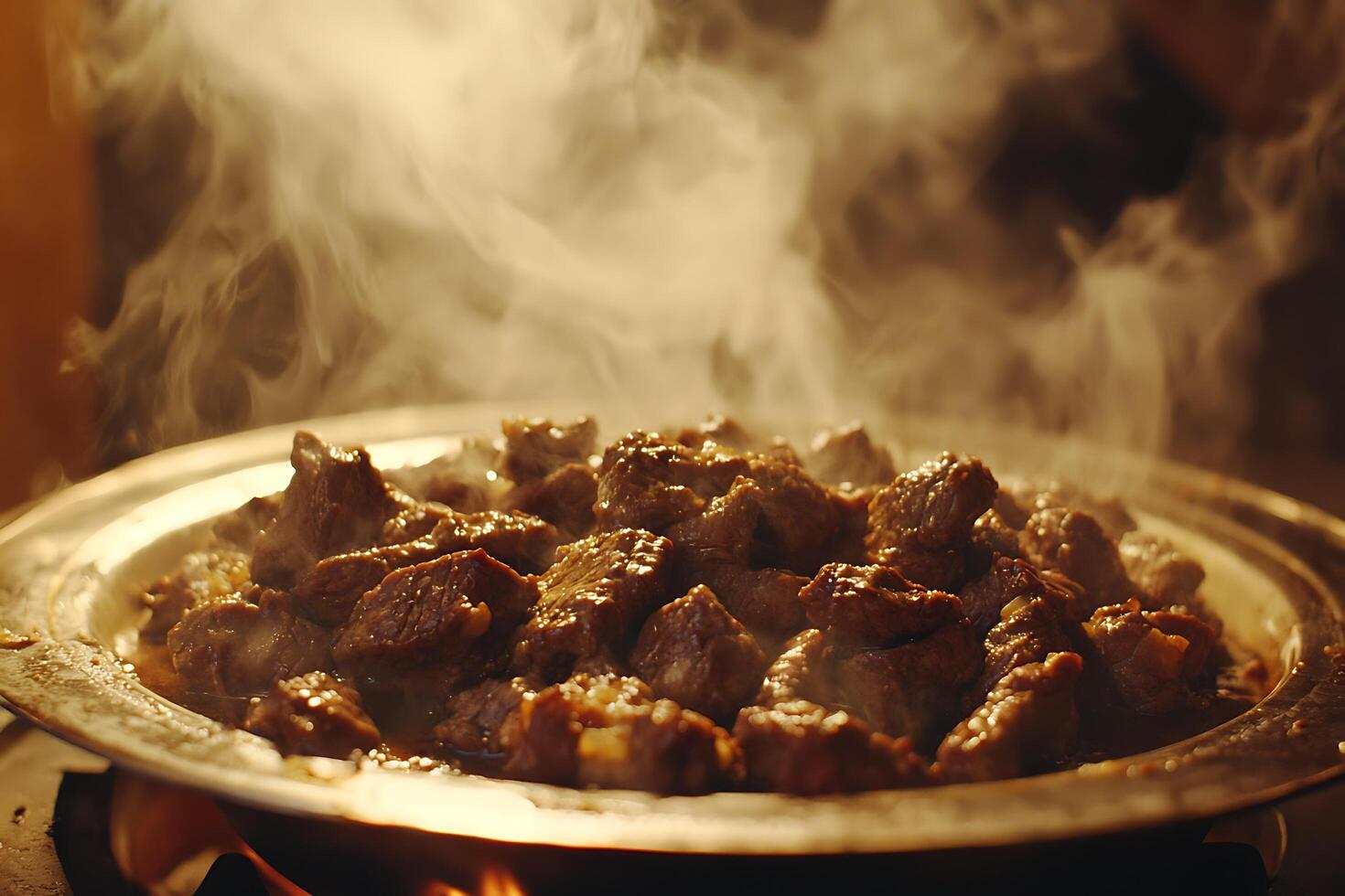 Steaming Hot Diced Beef in a Rustic Metal Pan. A Close-Up Image of Deliciously Cooked Meat. photo