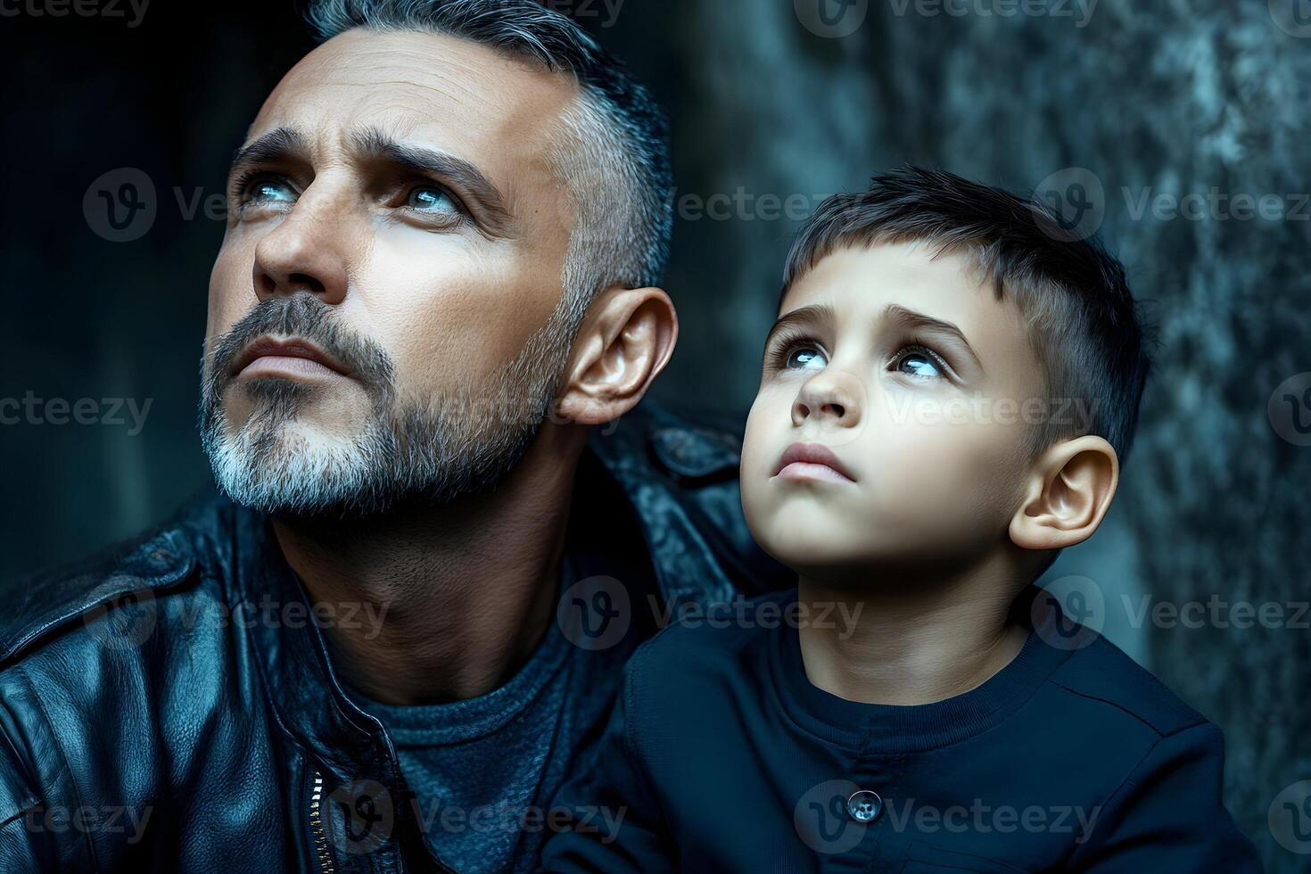 portrait of bearded man and boy with dramatic lighting photo