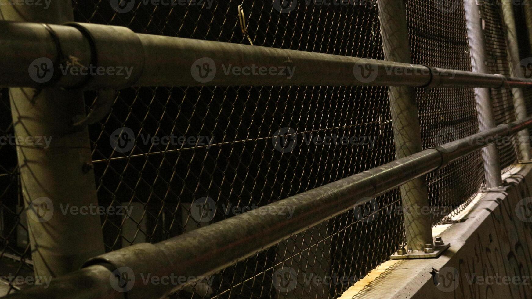 6 Wire mesh bridge on the side of the road photo