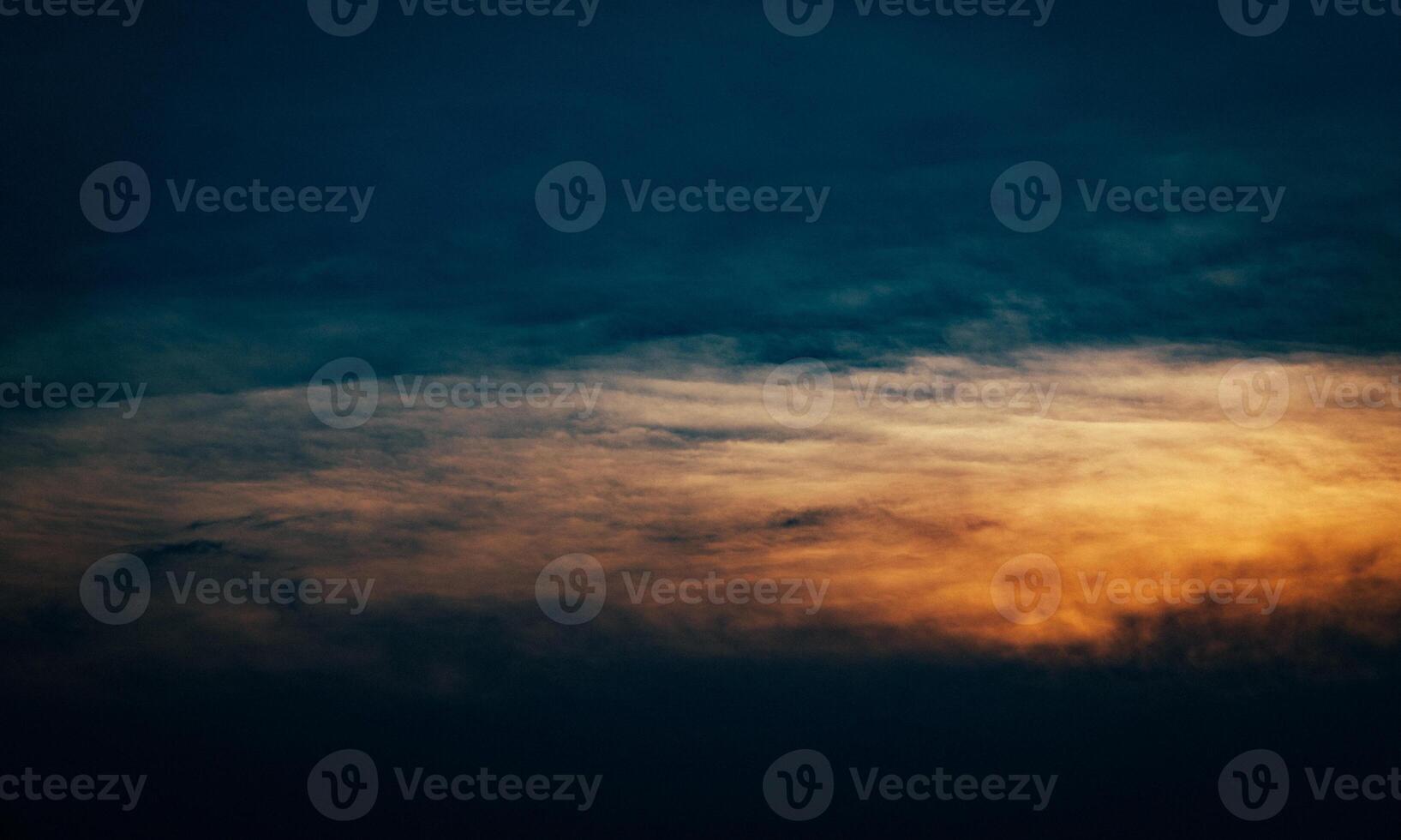 Dramatic sunset cloudscape fills the twilight sky. photo