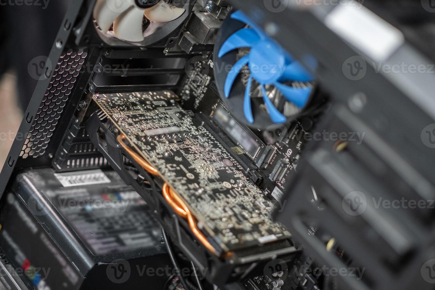 Inside view of a computer showcasing the graphics card, fans, and power supply in a well-organized case during a build project photo