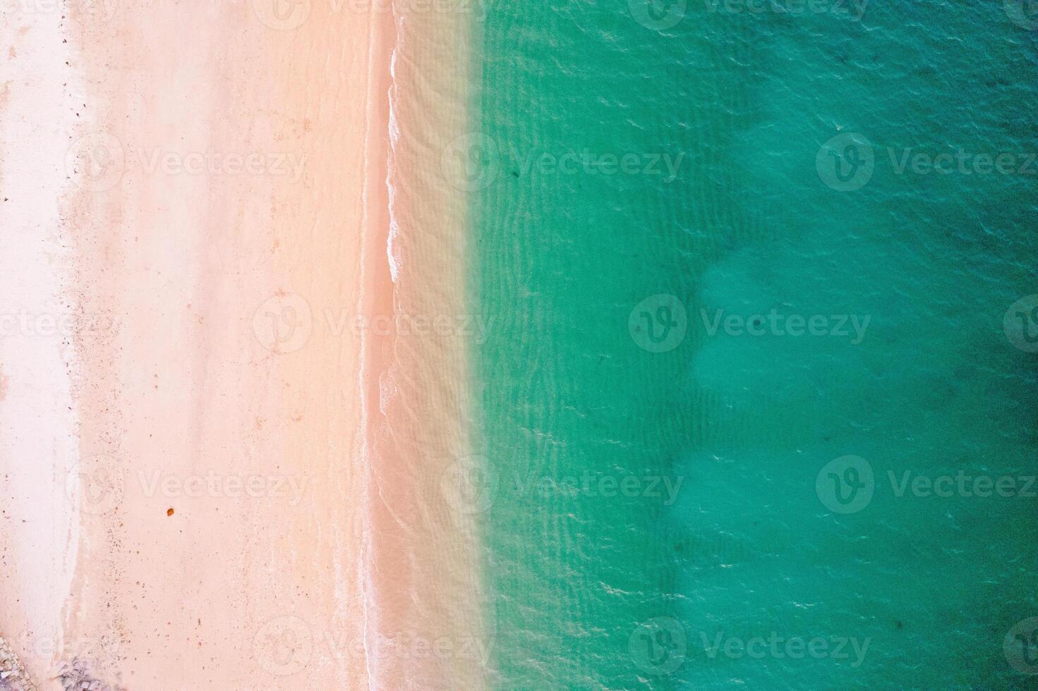 beach aerial view clear water shoreline coastal patterns, top down view aerial drone photo. Summer concept background photo