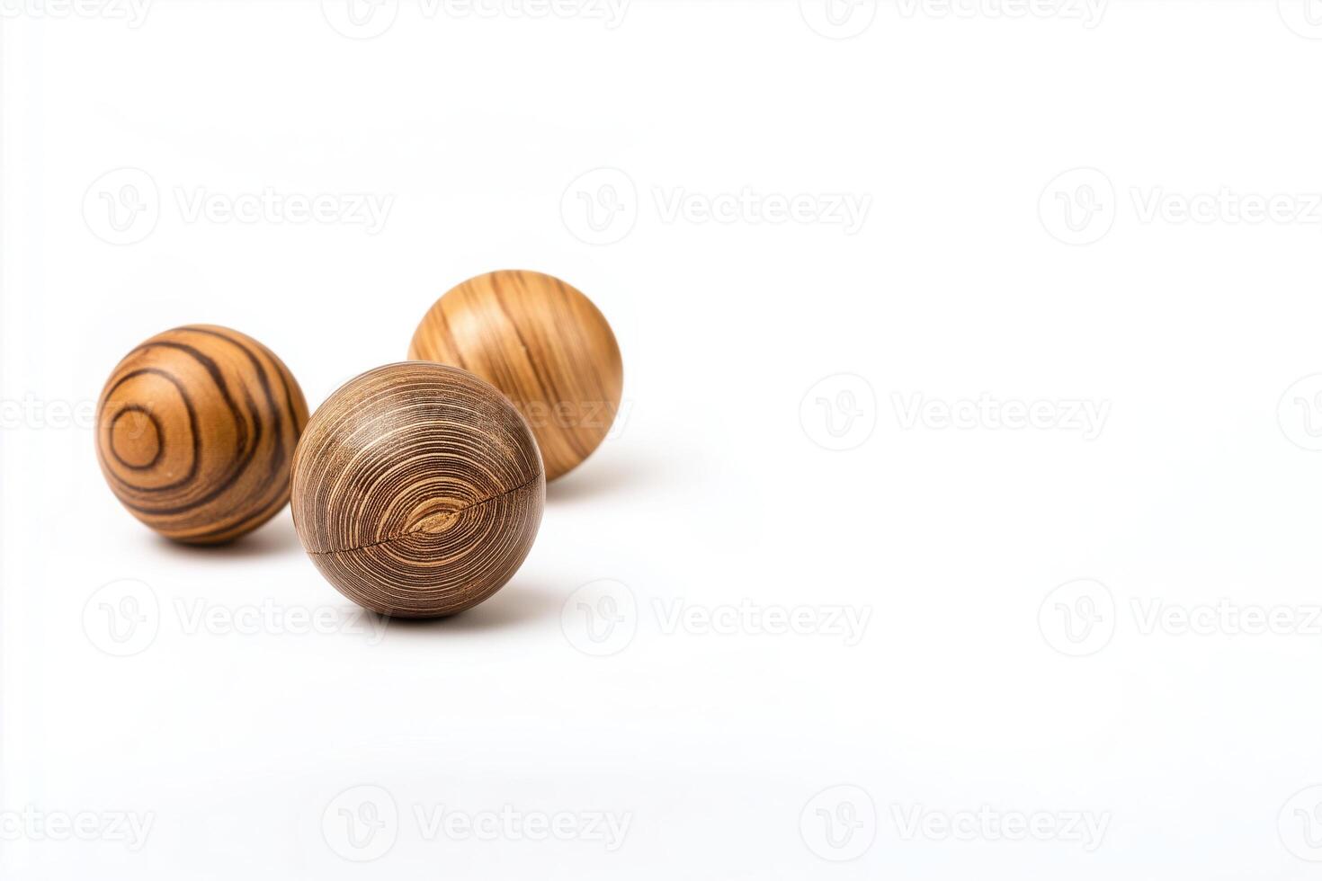 Three wooden ball sitting on white background looks so polished and neat, conveying feeling of calmness and simplicity in their isolated setting photo