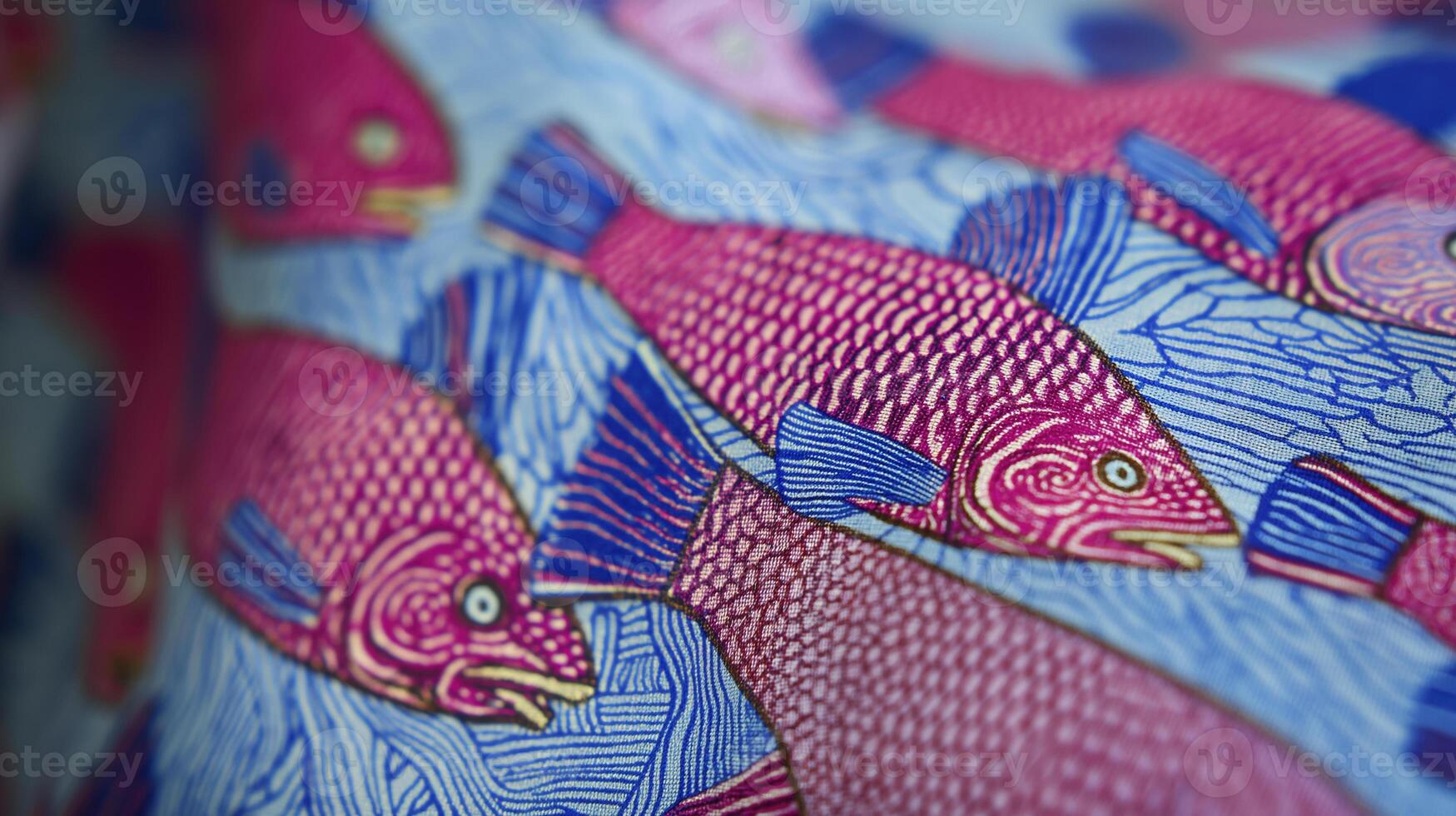vibrant close up of fabric pattern featuring colorful fish in shades of pink and blue, showcasing intricate details and textures photo