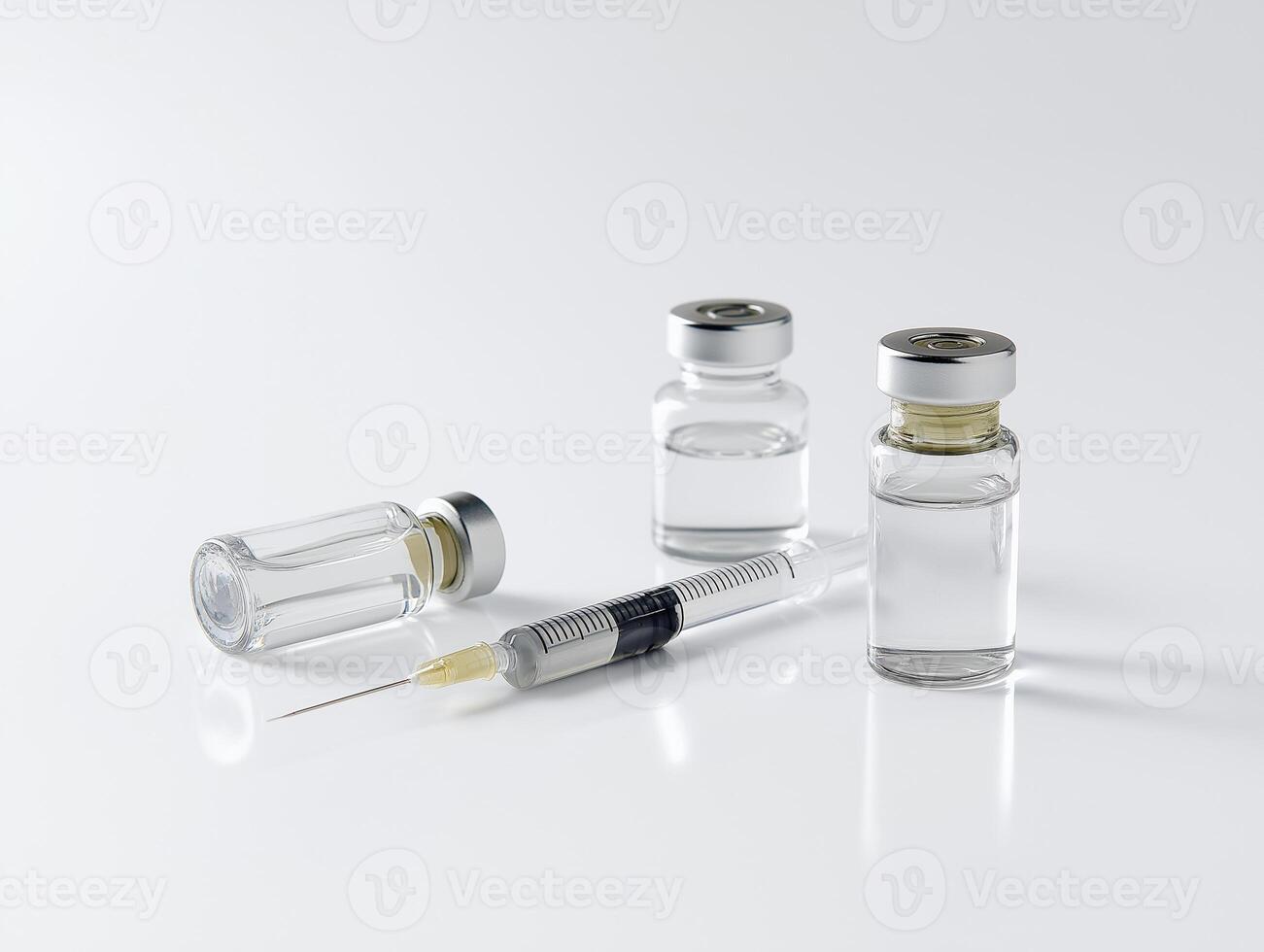 syringe and two vials on table with clean white background, symbolizing medical preparation and health photo