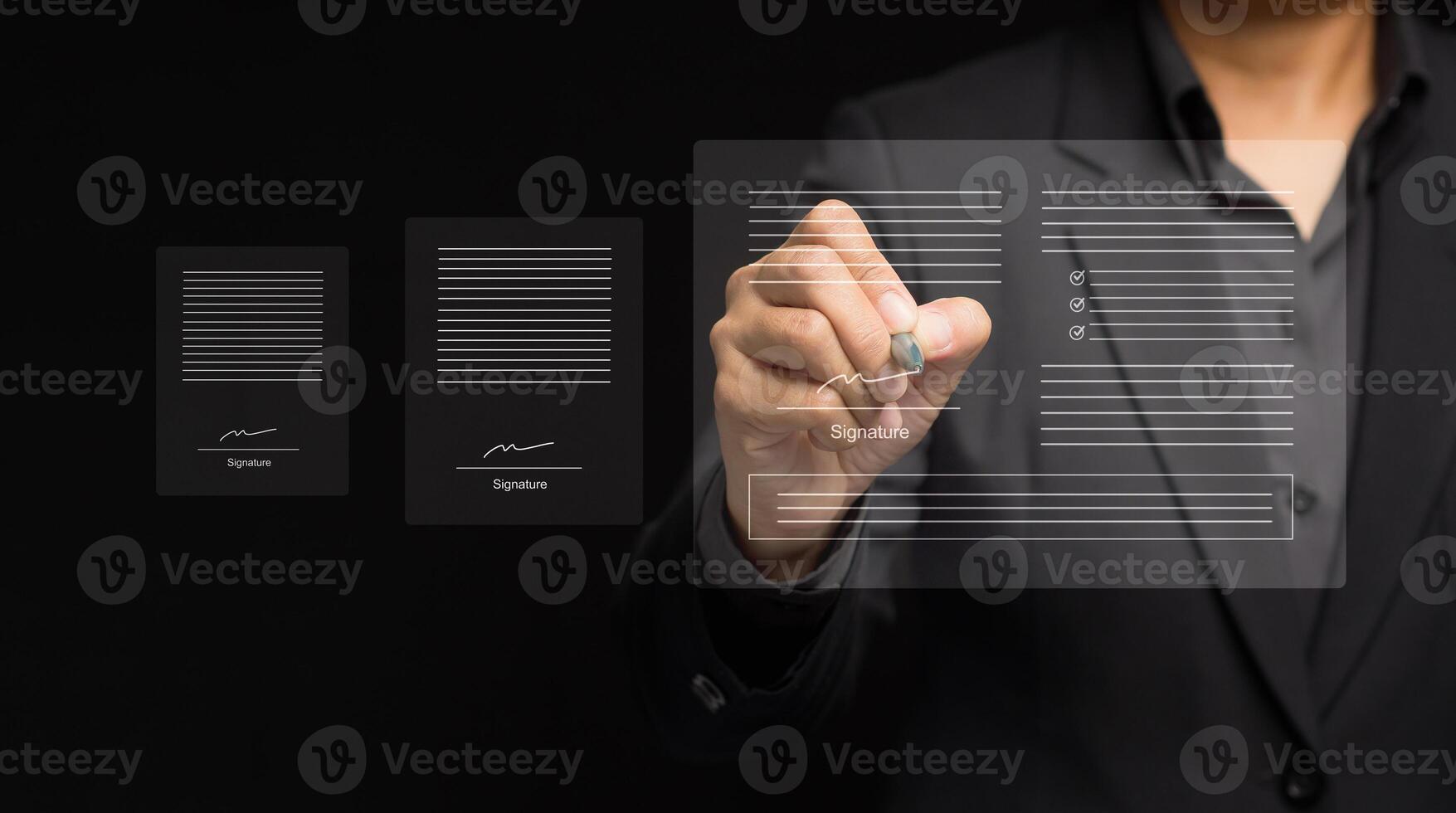Close-up of a businessman uses a pen to sign electronic documents on a virtual screen while standing on a black background photo