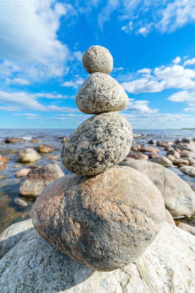 Pyramid of stones. Unstable balance of stone objects. Amazing balance of stones. photo