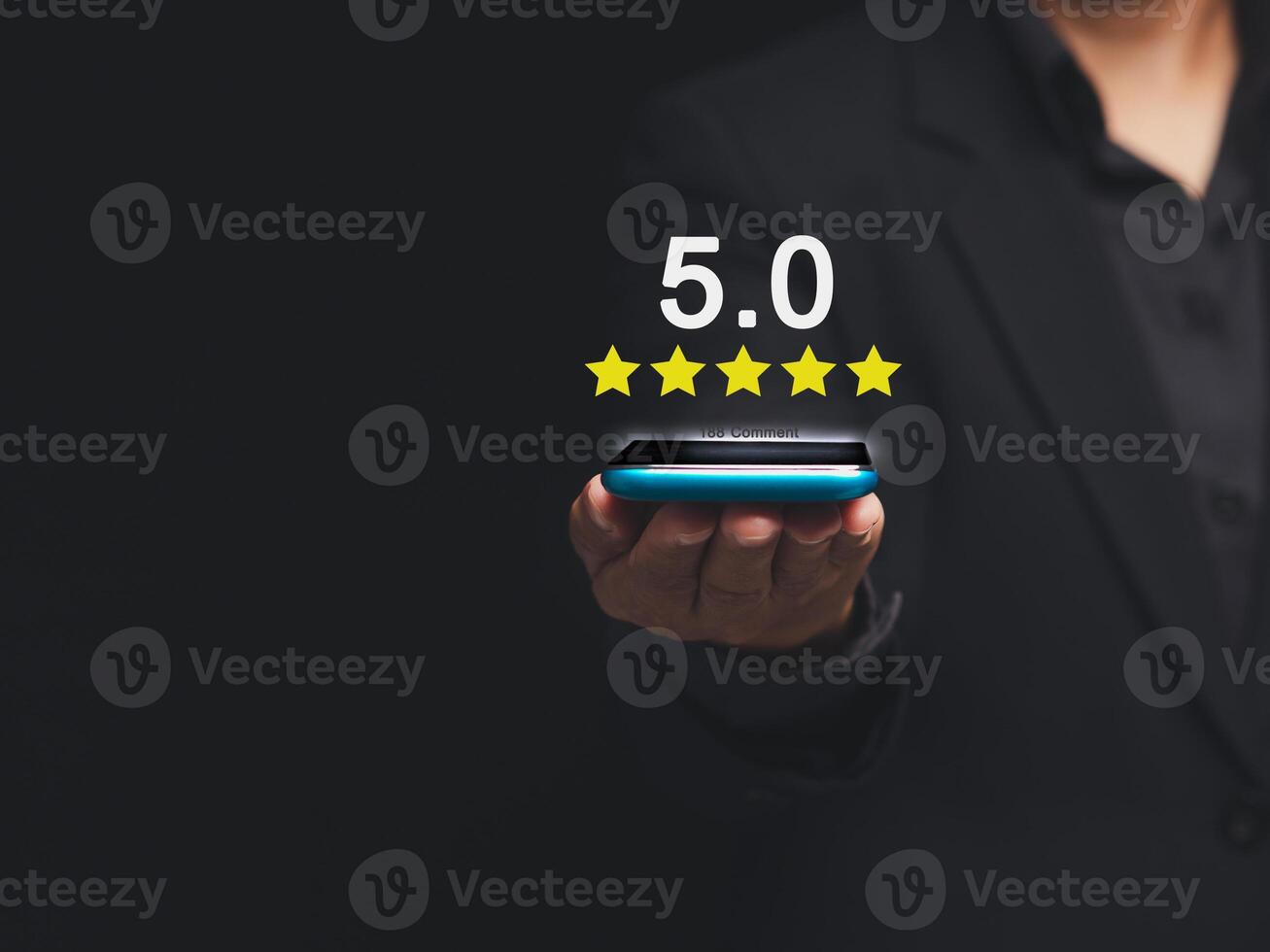 Close-up of Satisfaction and feedback surveys. A businessman in a suit using a smartphone gives the five-star icon a rating of very impressed for service photo