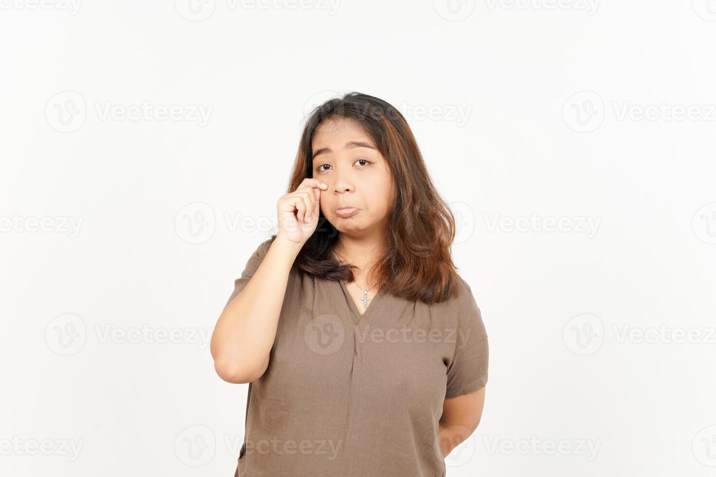 Asian woman with her hand on her face photo