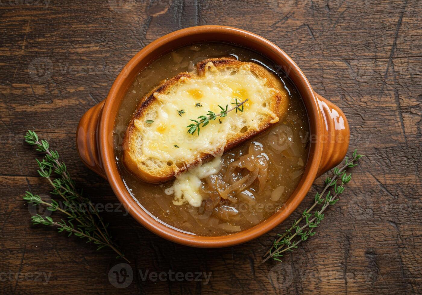 French Onion Soup with cheesy bread and thyme photo