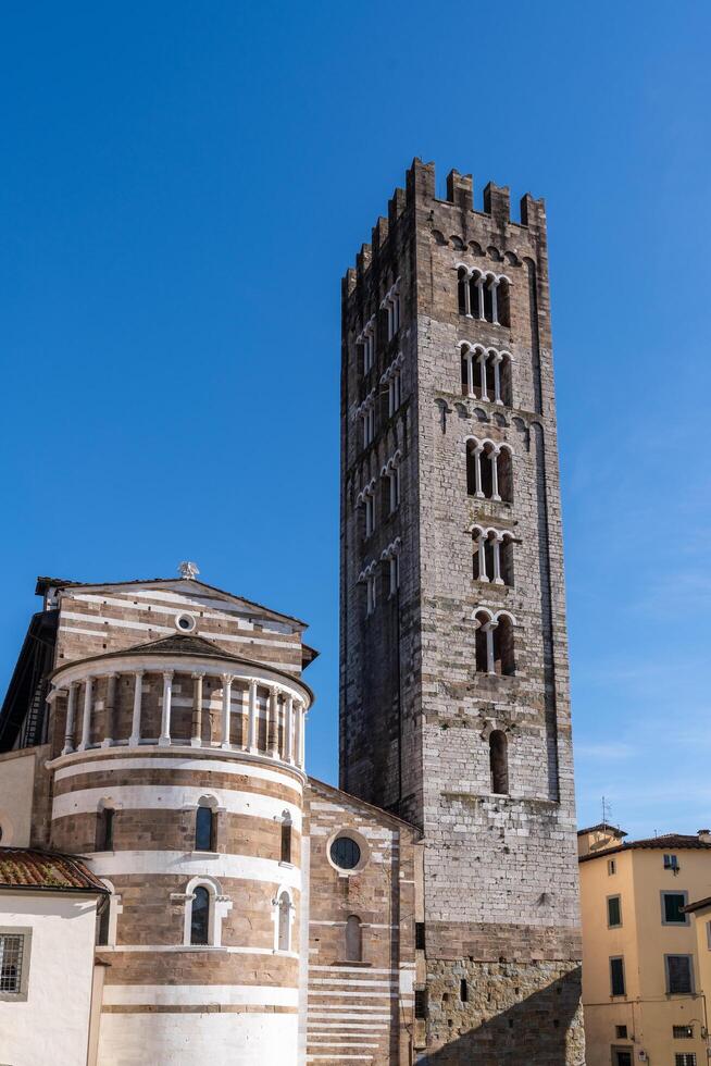 Lucca, Italy-February 16, 2025-vertical photograph of the Basilica of San Frediano during a sunny day photo