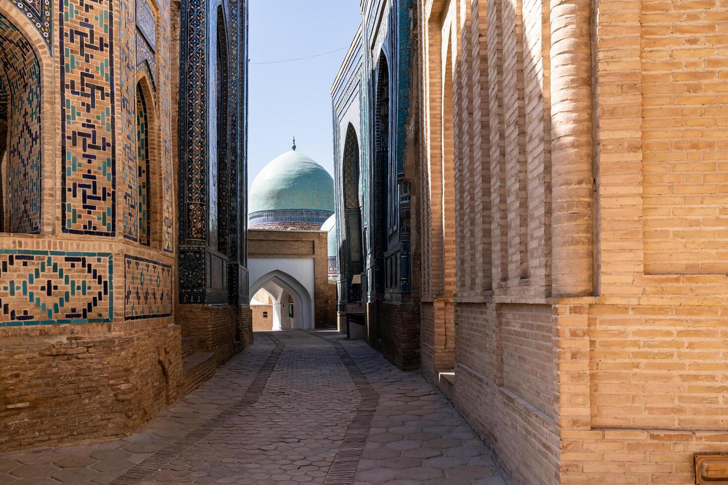 Samarkand, Uzbekistan- august 13, 2023-People visit Shakhi Zinda necropolis, a famous mausoleum complex in Samarkand photo