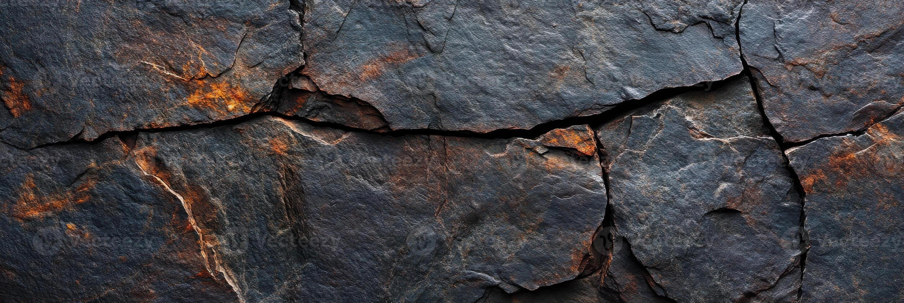Weathered rock surface with natural patterns and textures in rustic shades photo