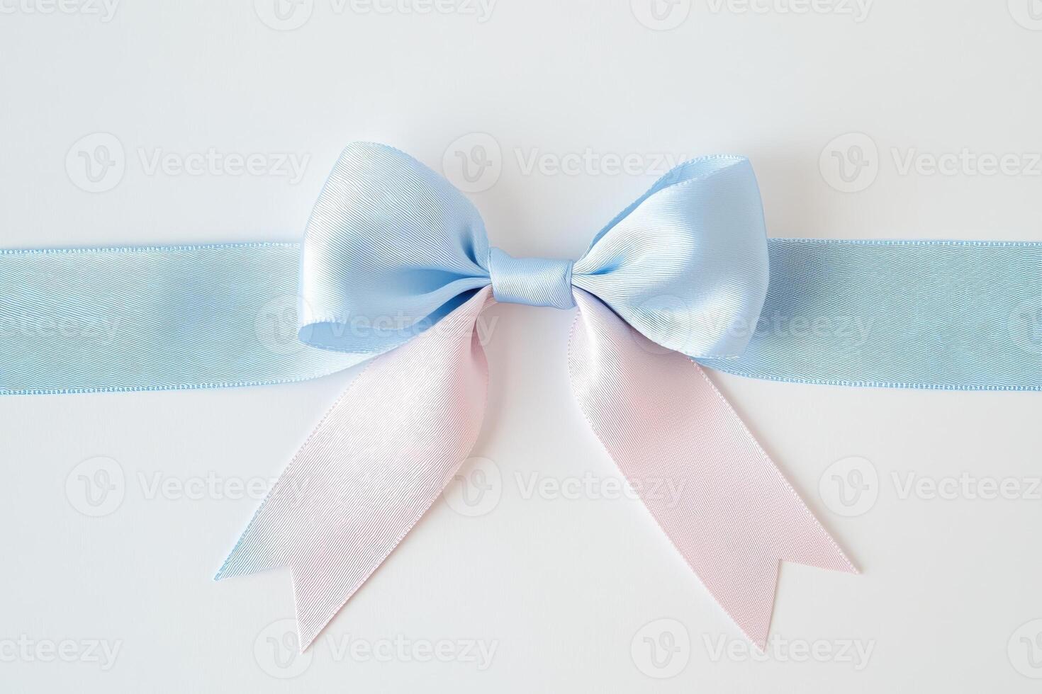 Elegant blue and pink ribbon bow on white background for gift presentation or decor photo