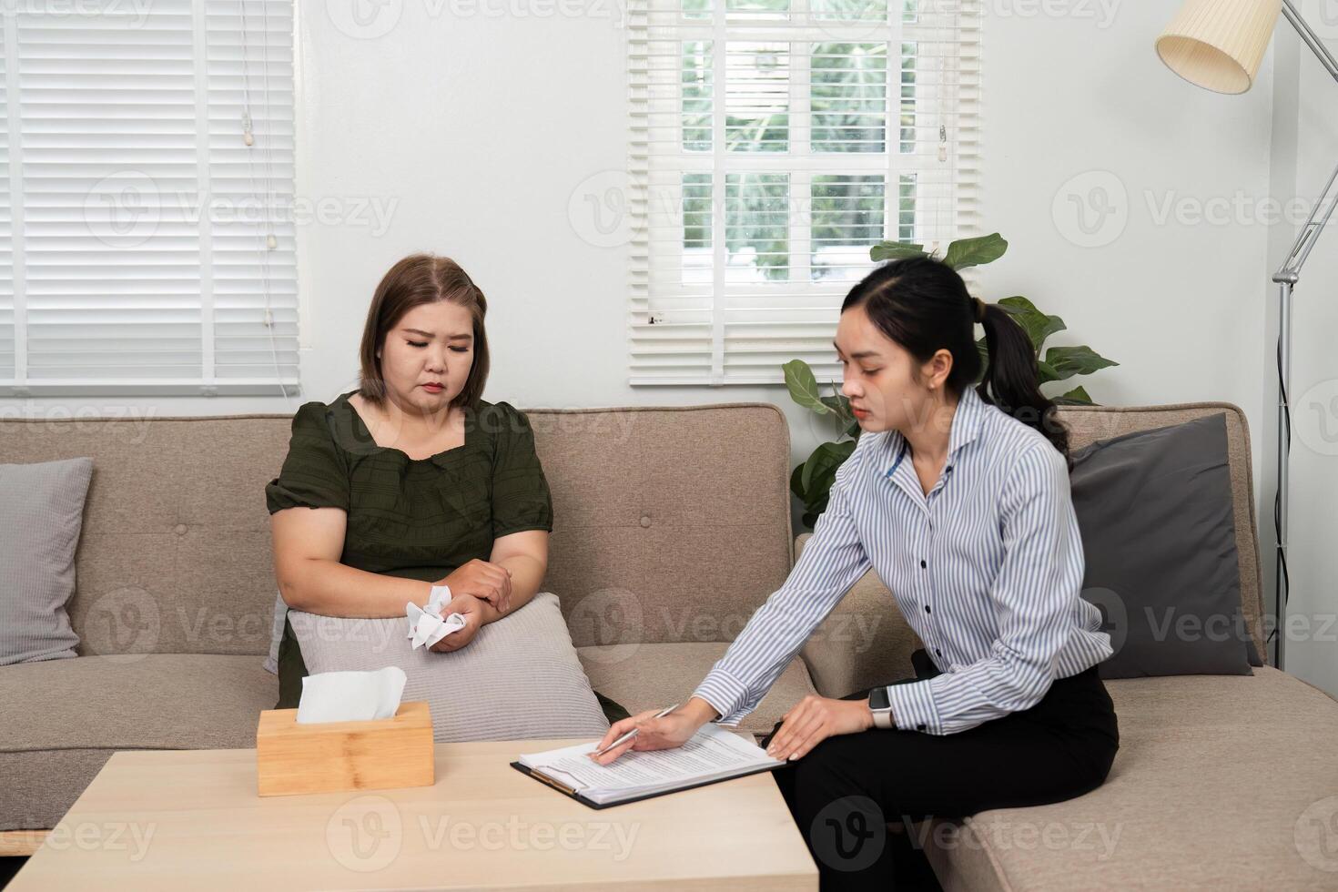 Dialogue and Reflection. A therapist and client engage in meaningful conversation during a therapy session. photo
