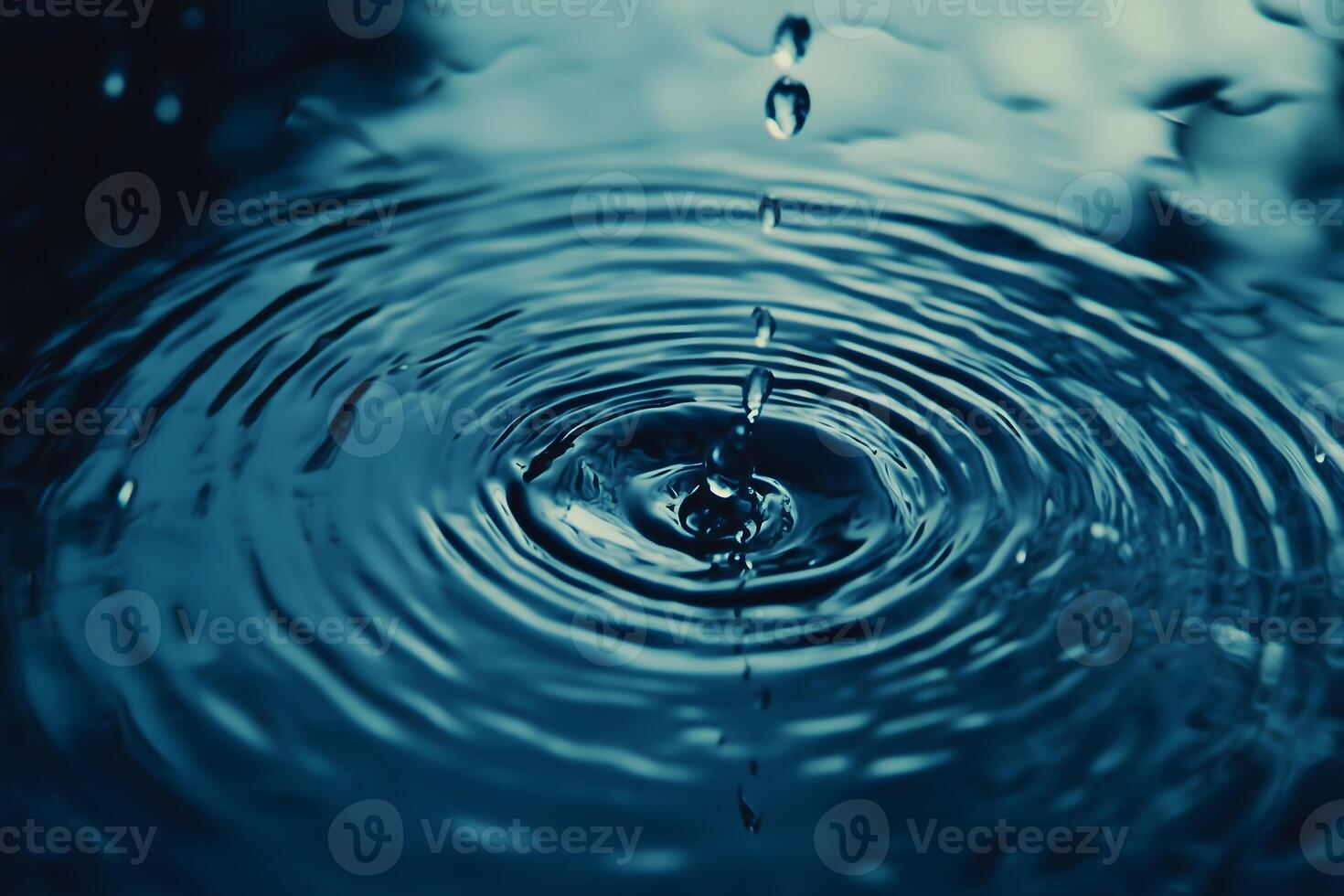 Water droplets falling into a water drop photo