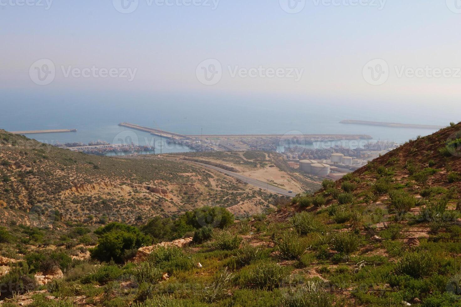 Panoramic view of Agadir port, green hills and ocean horizon in Agadir city photo