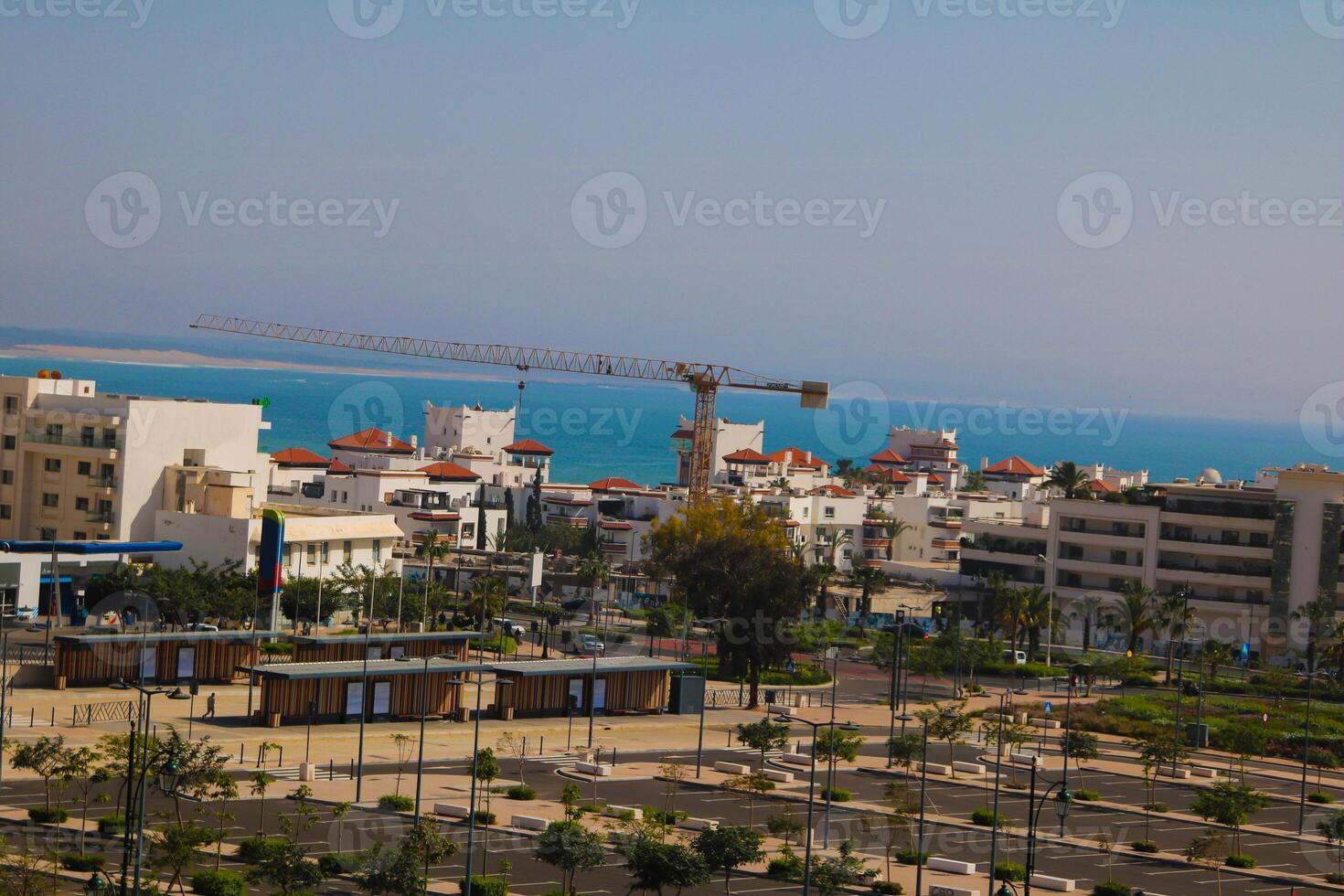 Construction site and skyline in agadir morocco, view of agadir beach and coastal buildings photo