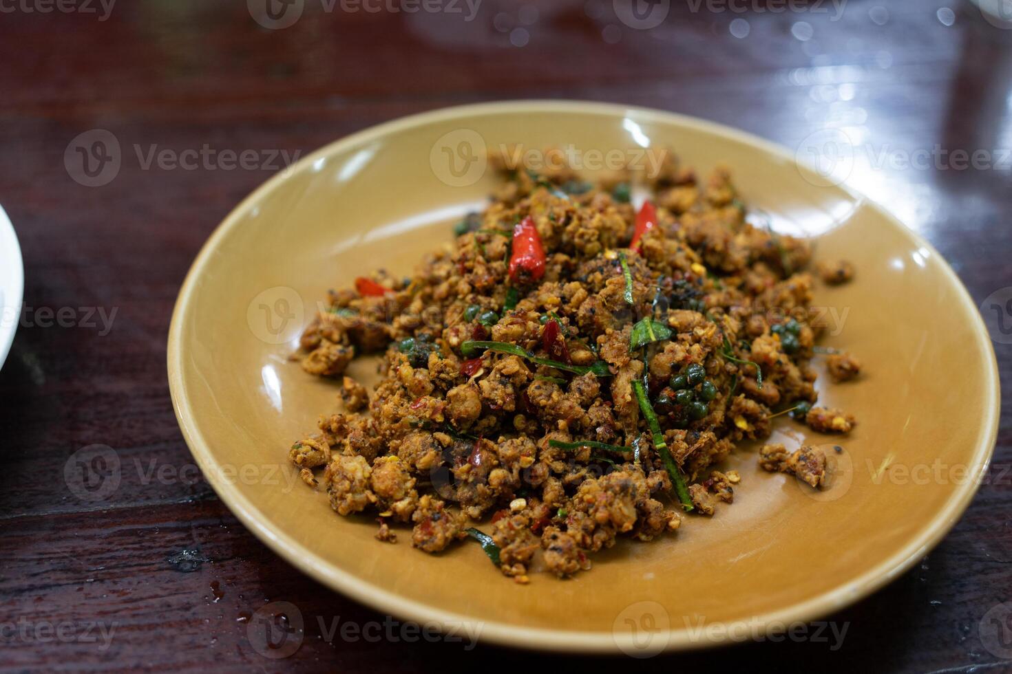 Stir fried pork with tellow curry paste photo