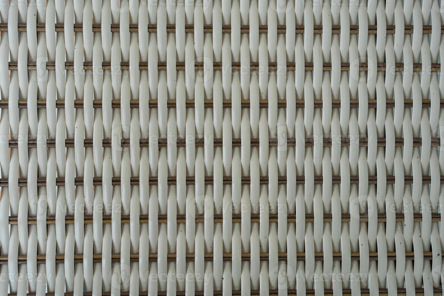 White background with the artificial texture of woven rattan. photo