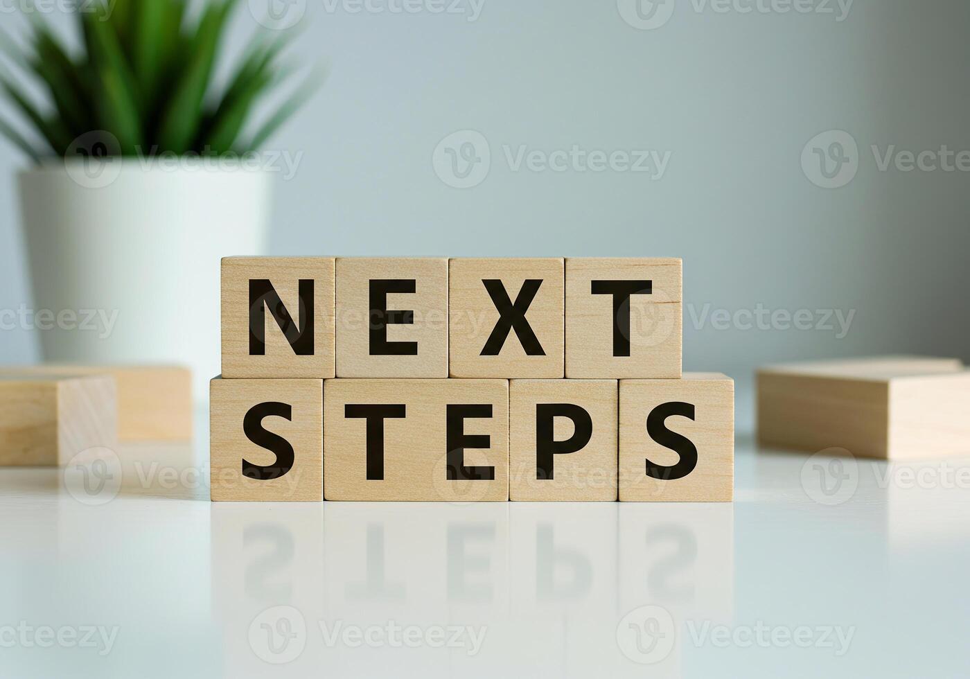 Next steps block with wooden blocks on table photo