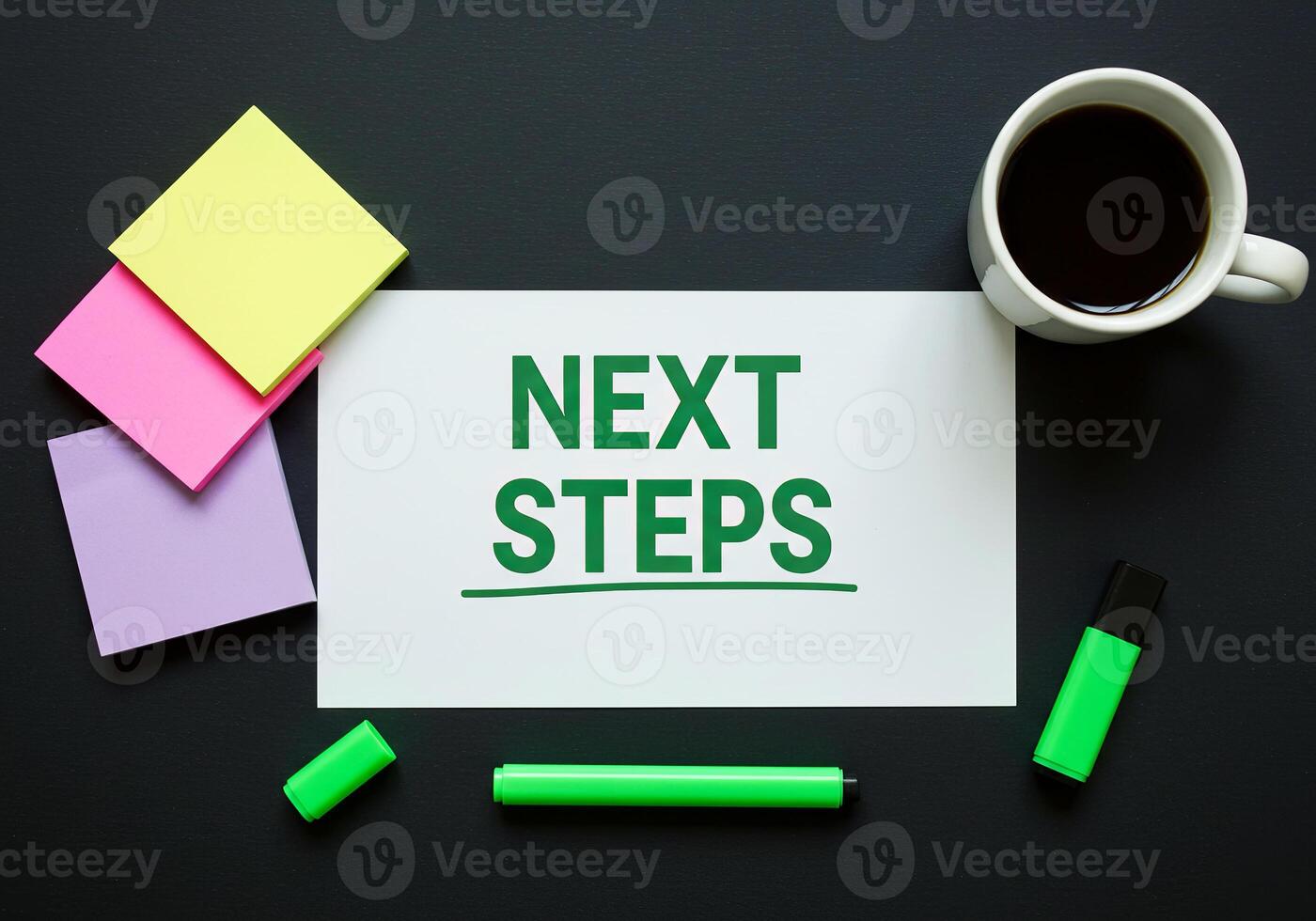 Next steps on paper with sticky notes and coffee cup photo