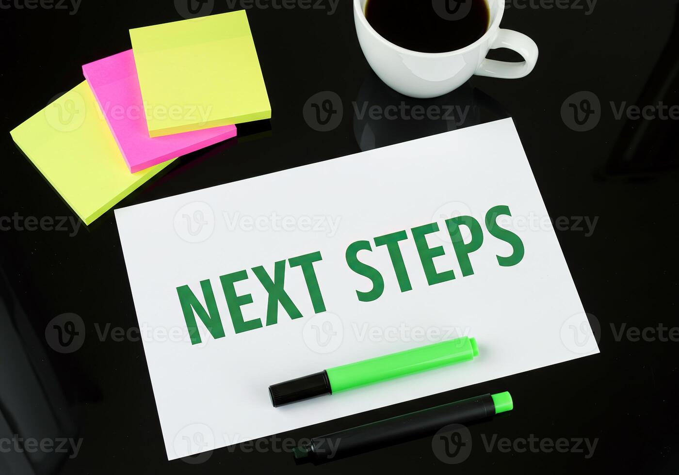 Next steps on paper next steps on paper with sticky notes and coffee cup photo