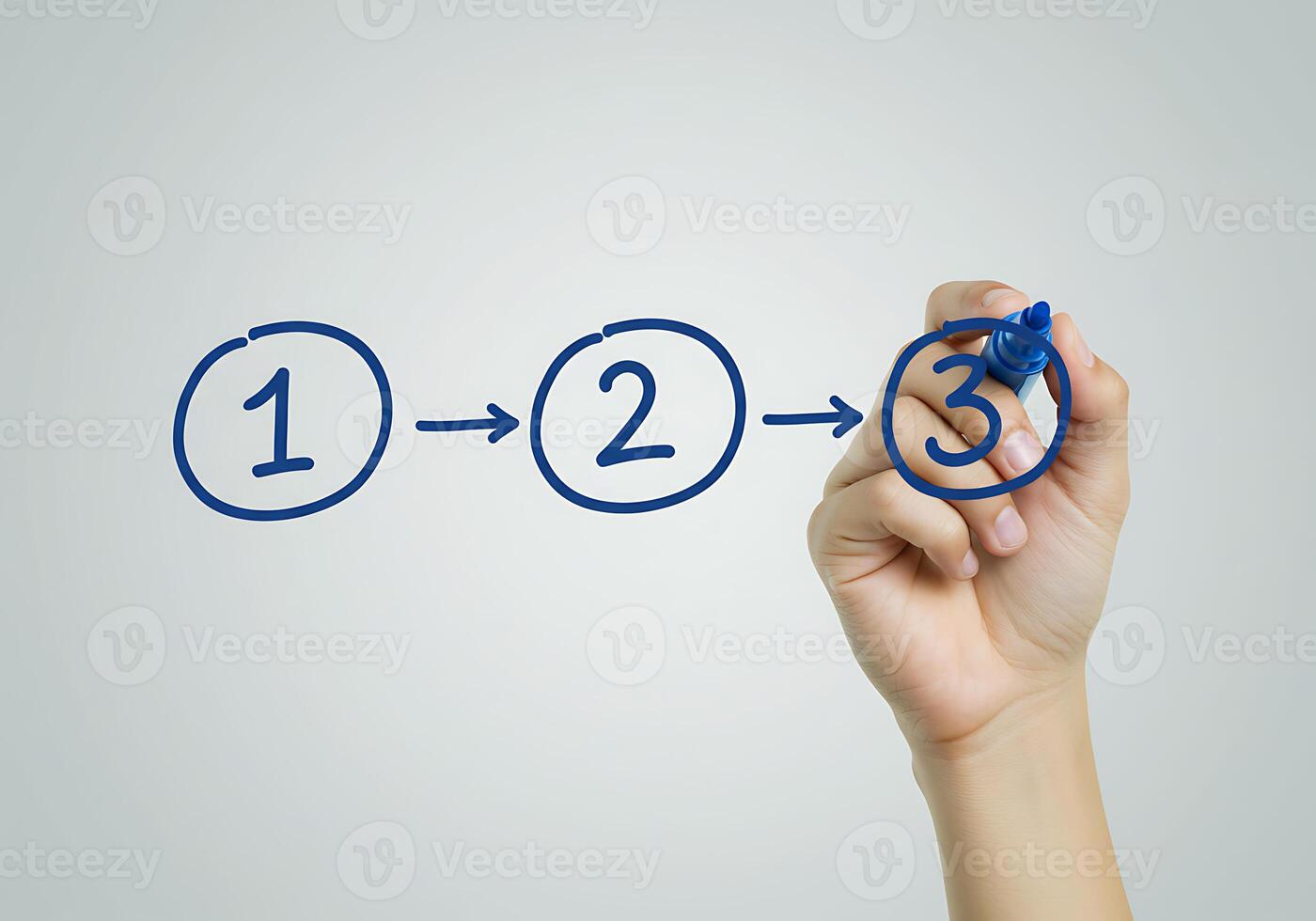 Hand drawing a number on a board with a marker photo