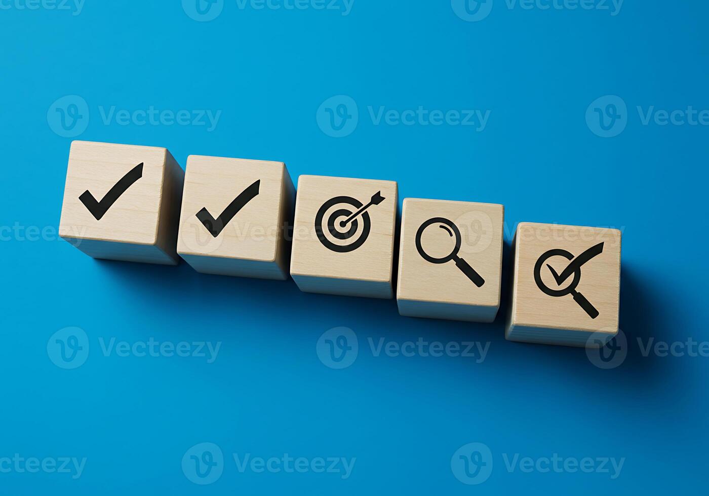 A wooden block with check marks and arrows on it photo