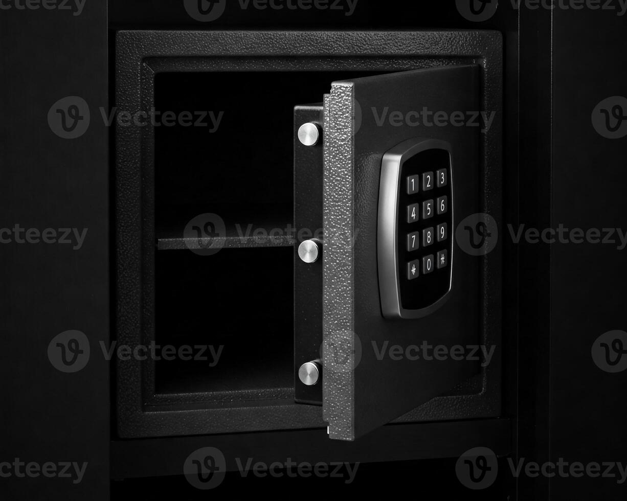 Metal safe box in the closet. Small narrow safe for keeping money or valuables in the hotel. Open safe door with buttons for entering a password. Compact strongbox inside cabinet. Empty safe. photo