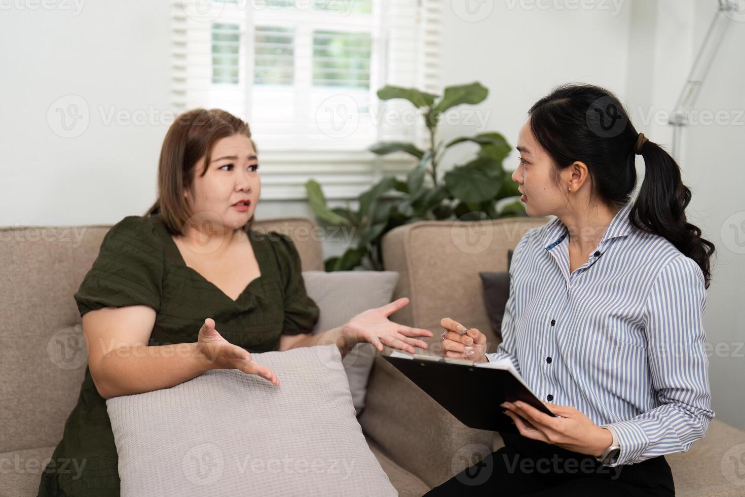 Mental Health Discussion and Professional Guidance. A psychiatrist engages her client in meaningful conversation about emotional well-being during a counseling session. photo
