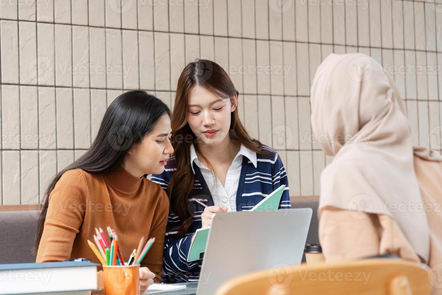 Focused Collaboration and Academic Support. Students gather to collaborate on assignments, enhancing their learning experience together. photo