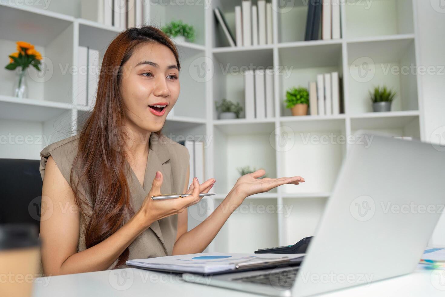 Dynamic Presentation and Communication Skills. A professional woman excitedly sharing ideas in a virtual meeting. photo