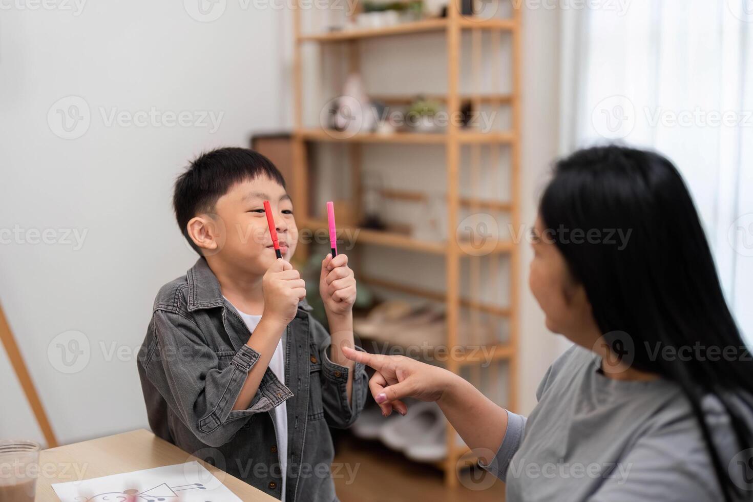 Back to School and Creative Play. A boy engaging in fun activities with his mother. photo
