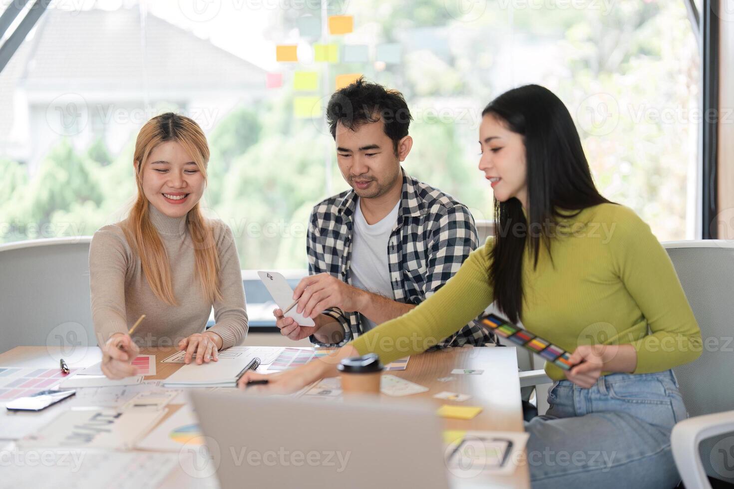 Diverse team working on creative concepts and planning in office. photo