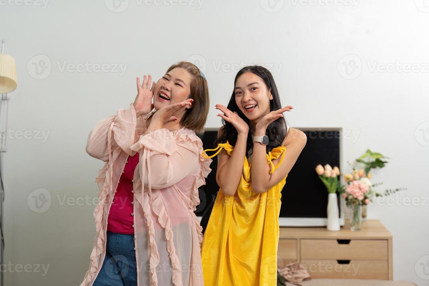 Joy and Style. Two friends capture a fun moment while showcasing stylish outfits, embodying happiness and connection. photo