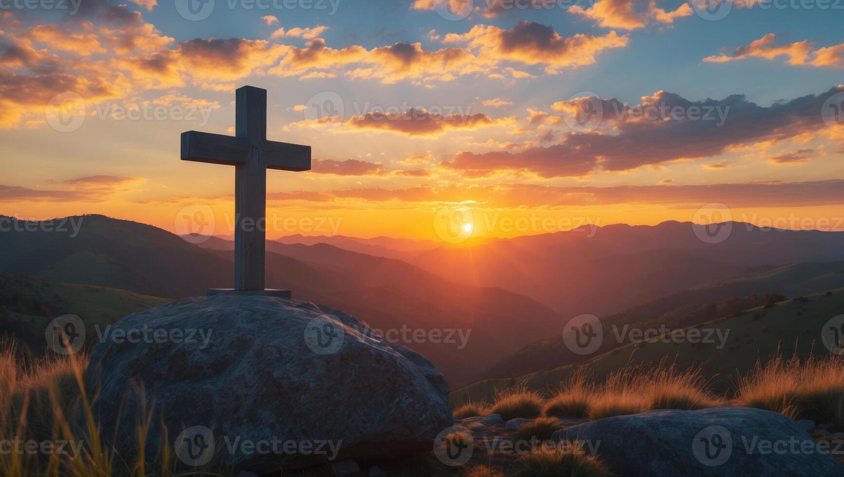 Cross on the mountain at sunset photo