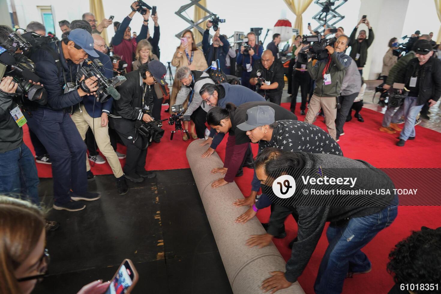 Workers during the ceremonial “red carpet rollout” event before the 94th annual Academy Awards at the Dolby Theatre on March 9, 2024. editorial_image