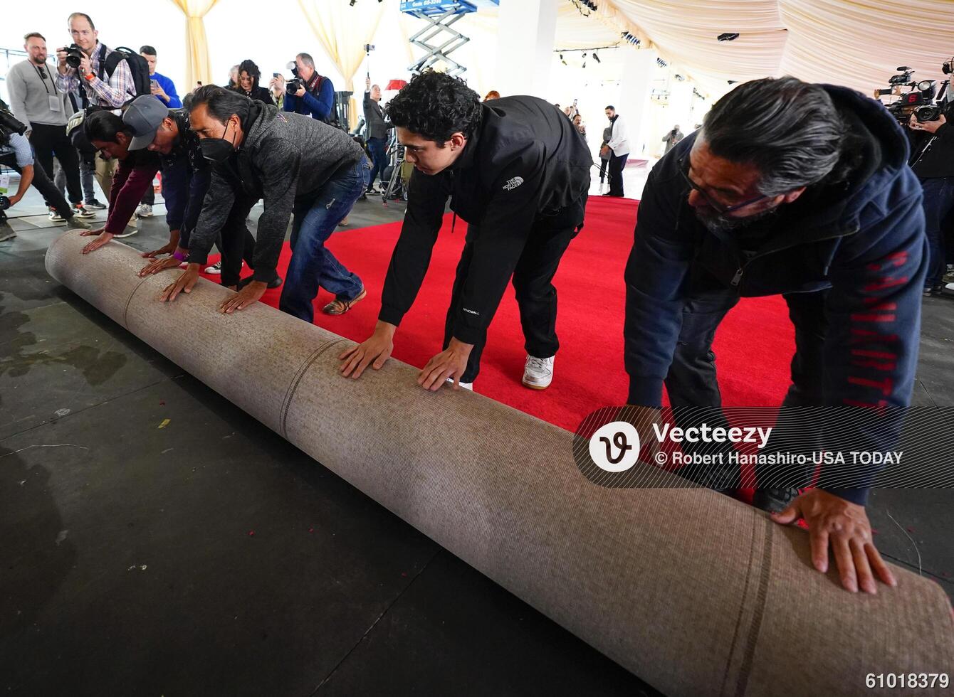Workers during the ceremonial “red carpet rollout” event before the 94th annual Academy Awards at the Dolby Theatre on March 9, 2024. editorial_image