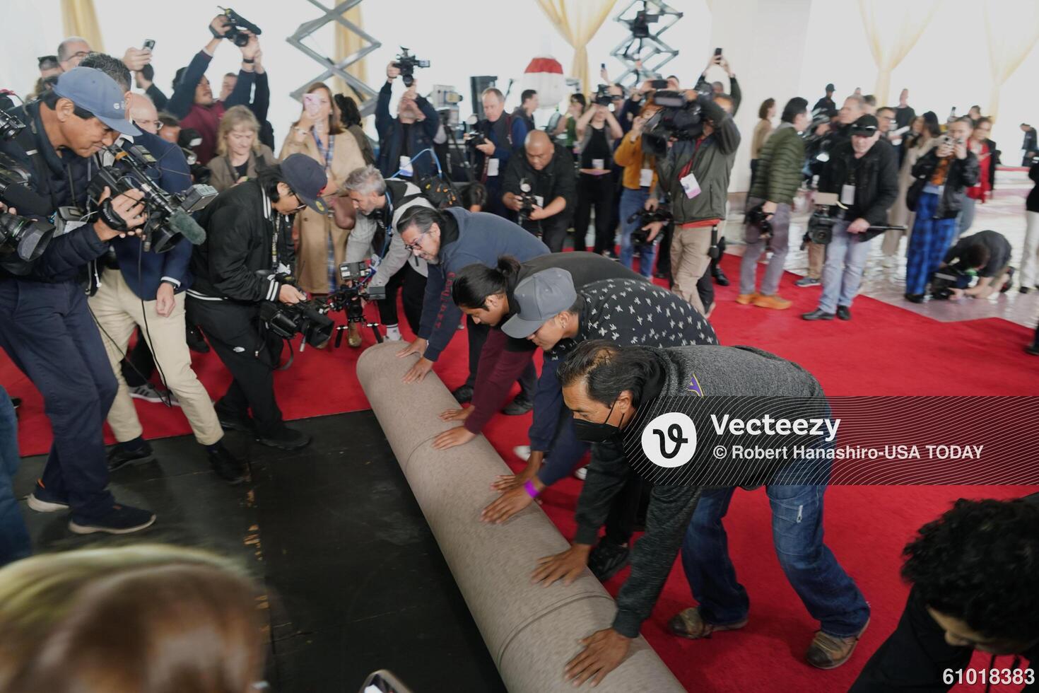 Workers during the ceremonial “red carpet rollout” event before the 94th annual Academy Awards at the Dolby Theatre on March 9, 2024. editorial_image