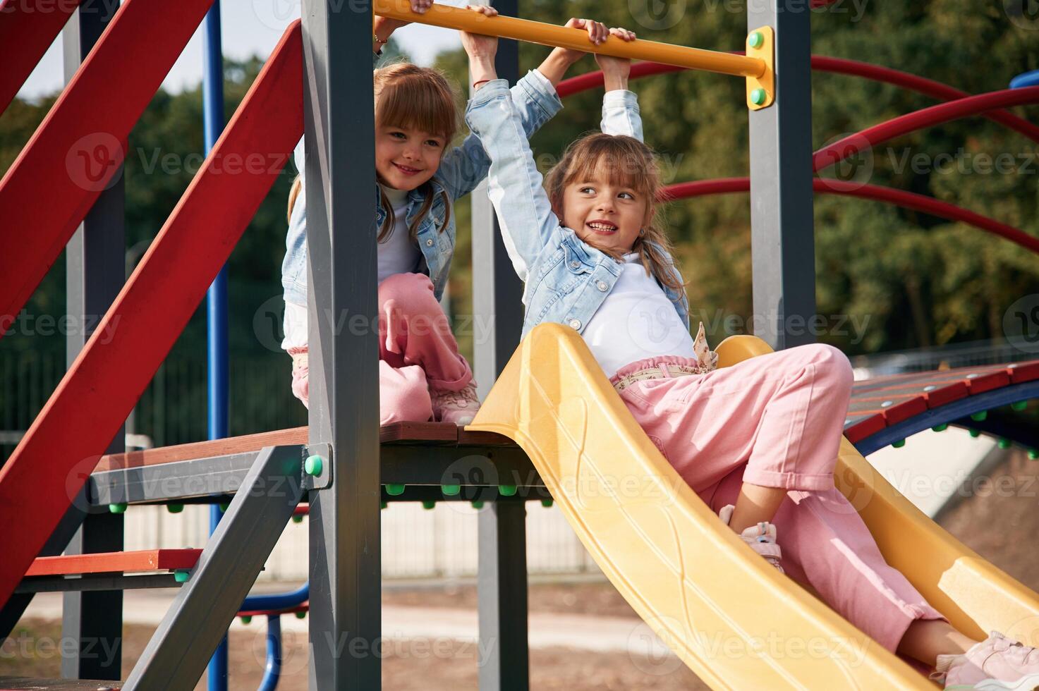 On the ,playground slide. Kids ,are having fun photo