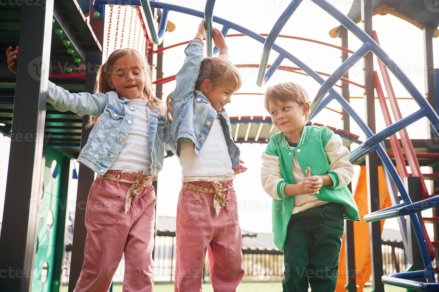 Front view. Kids are, having, fun on the playground photo