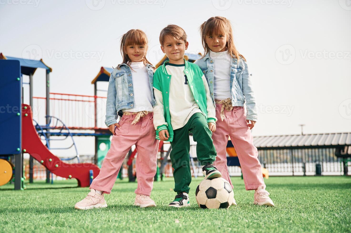 With, soccer, ball. Kids are having fun on the playground photo