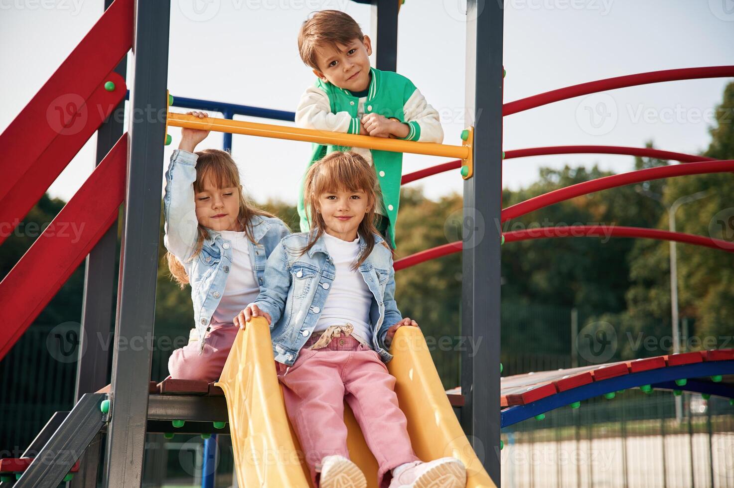 Beautiful ,sunlight.. Kids are having fun on the playground photo