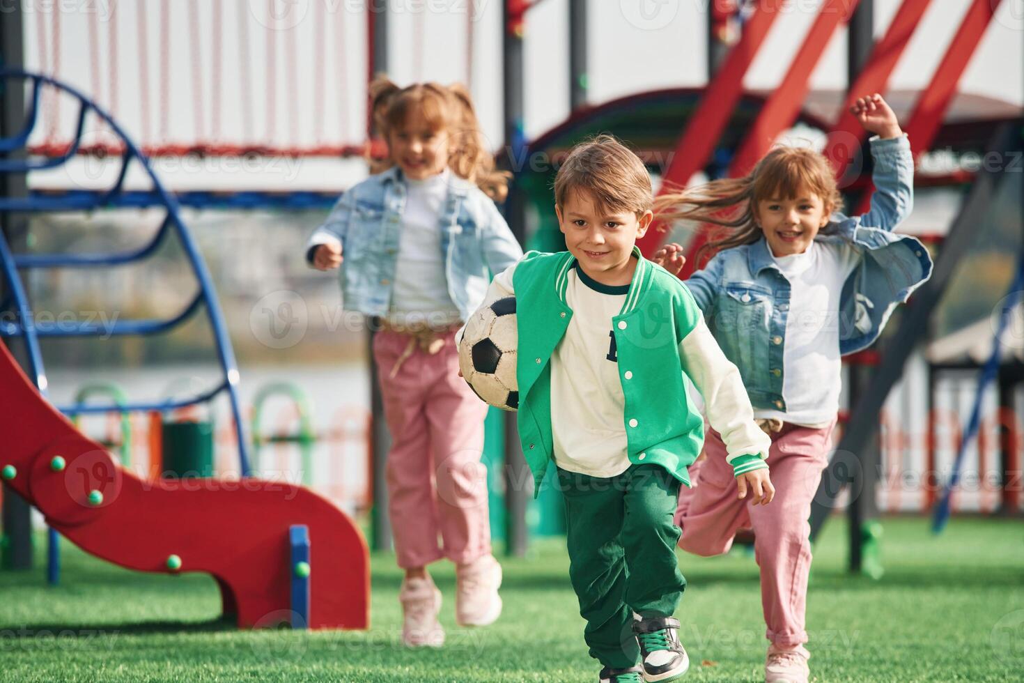 On the, playground. Kids, are having fun together photo