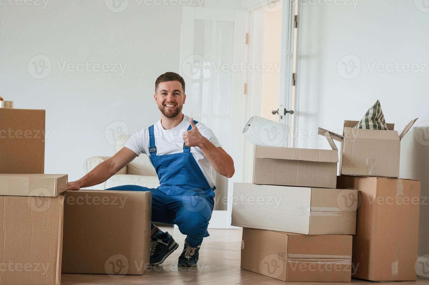Room full of boxes. Moving service employee photo