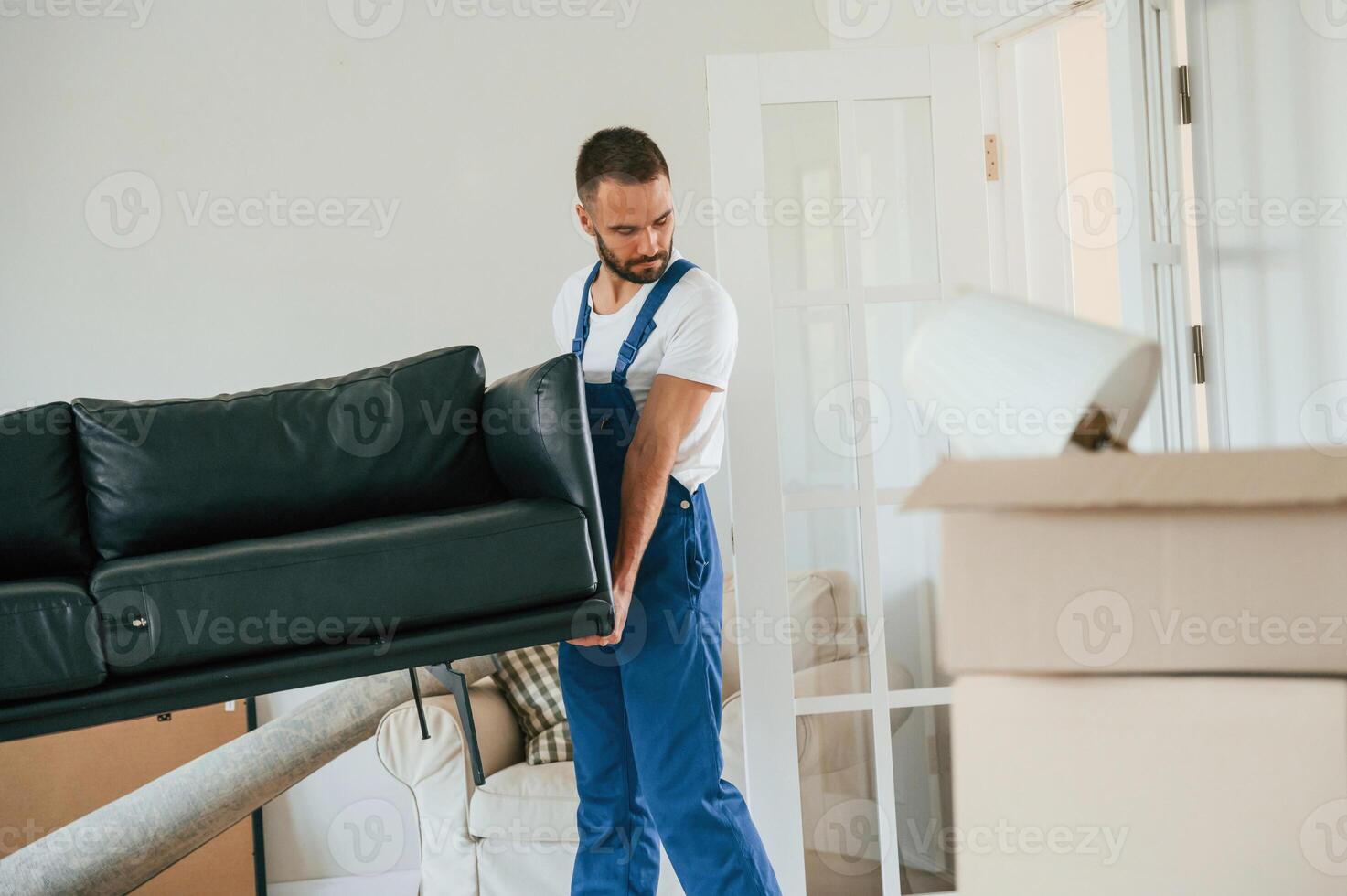 Moving service, employee in a room photo