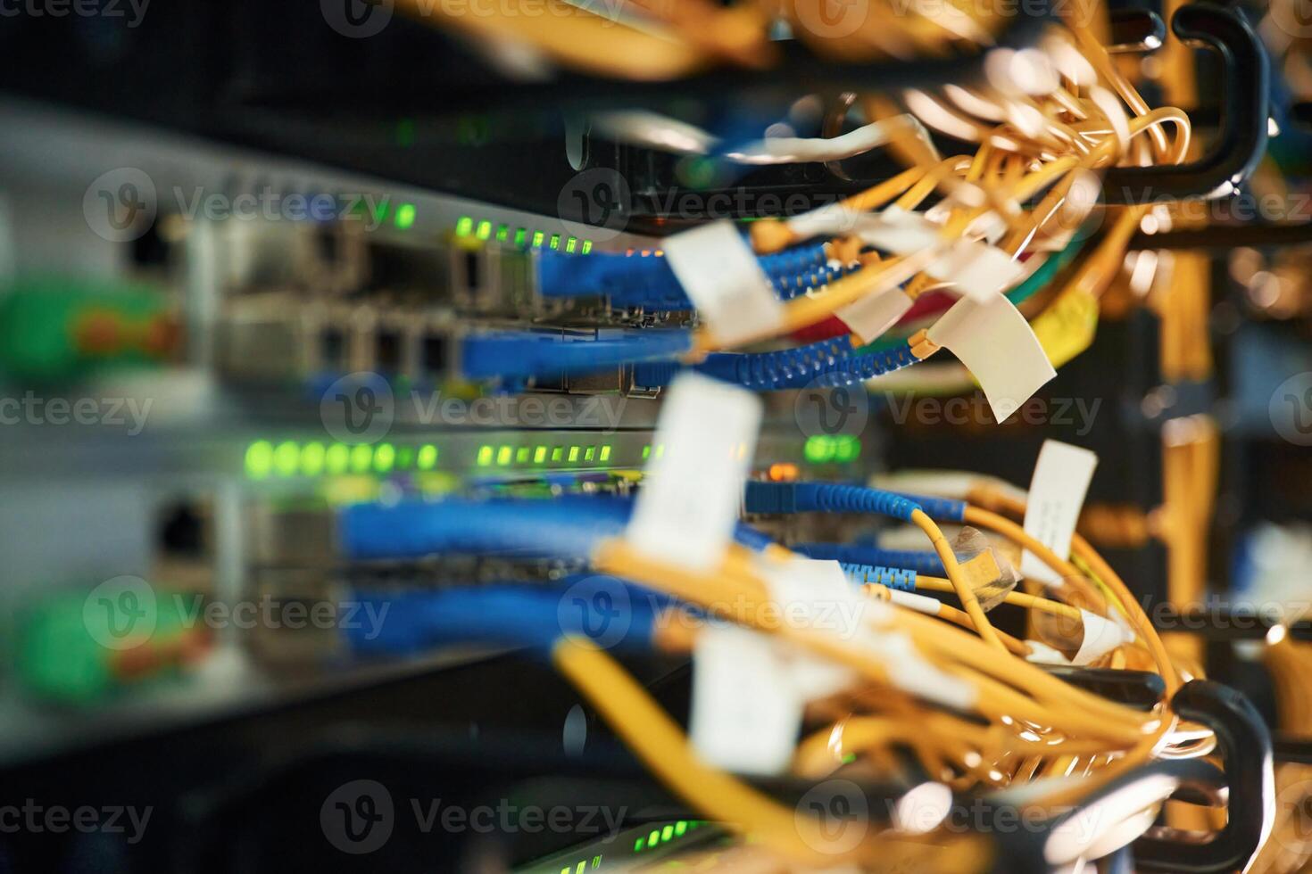 Blue and yellow wires., Close up view of hardware in the server room photo