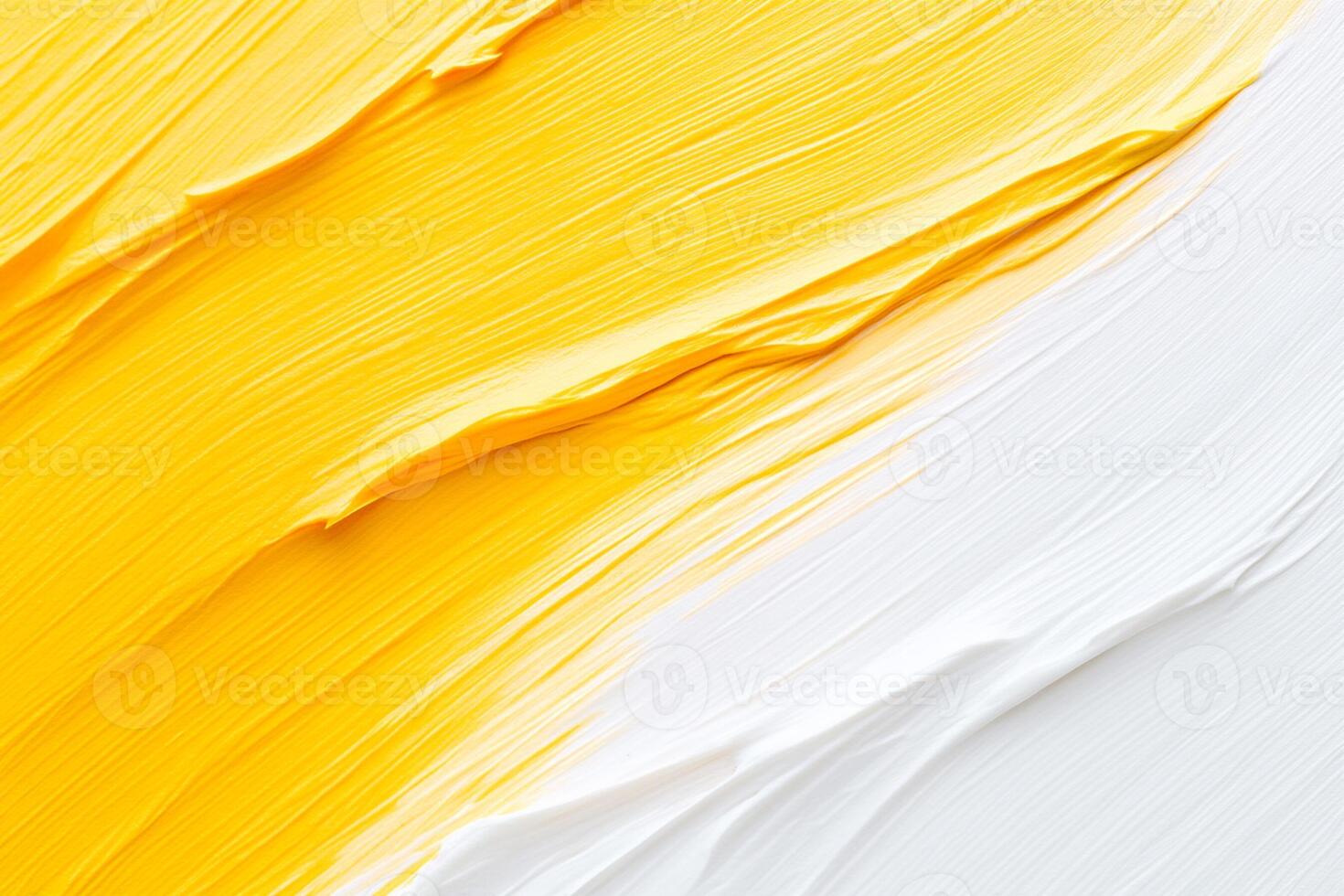 A close up of a yellow and white paint brush photo